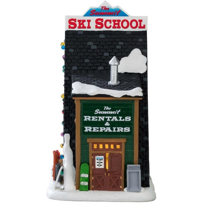 Scuola di sci in cima per villaggio natalizio