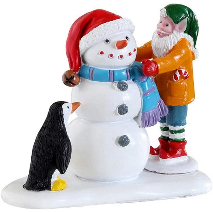 Creando un pupazzo di neve per villaggio natalizio