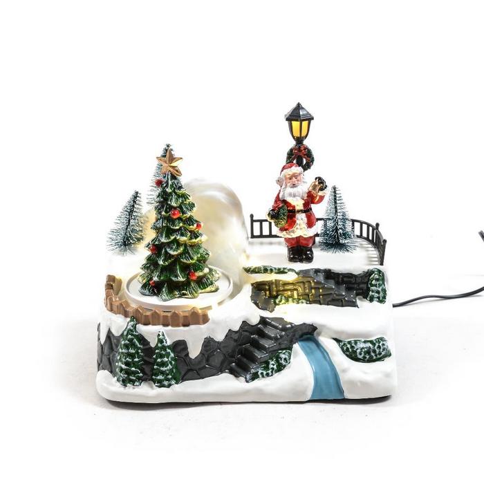 Paesaggio natalizio con musica, luci e movimento