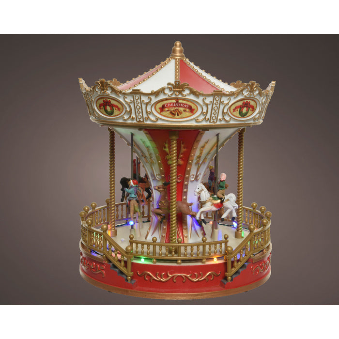 Giostra natalizia con LED multicolore con movimento e musica 28 cm