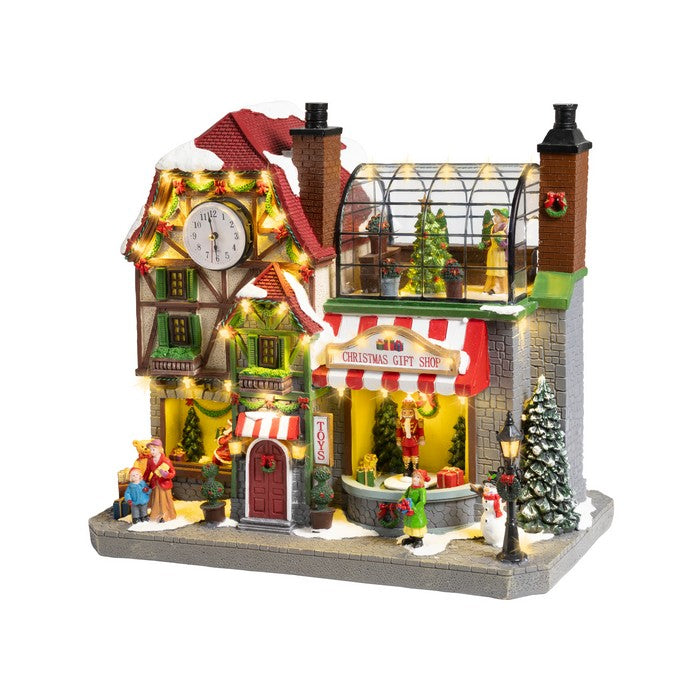 Scenario per villaggio natalizio in poliresina Gift Shop con musica, movimento e LED 44 cm